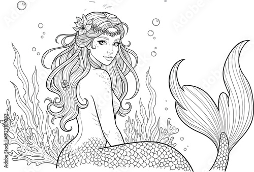 A beautiful mermaid with long hair and a flower in her hair sitting on the ocean floor surrounded by seaweed and bubbles