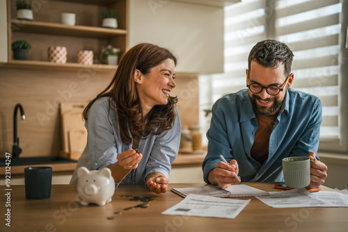 Happy couple budgeting and planning home finances