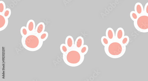 Cute pink and white animal paw prints.