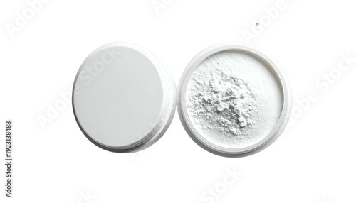 Top-down shot of white powder in a jar, lid open to the side, set against black background