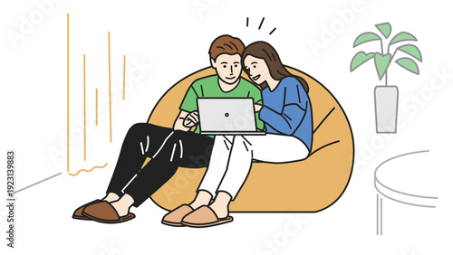 パソコンを操作しているカップル