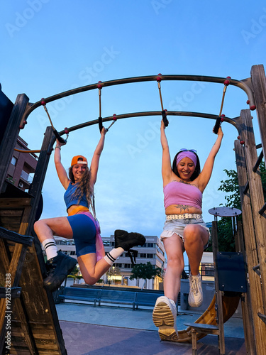 Friends on Playground at Sunset
