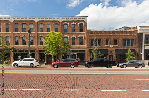 Historic downtown commercial buildings with brick road in Detroit