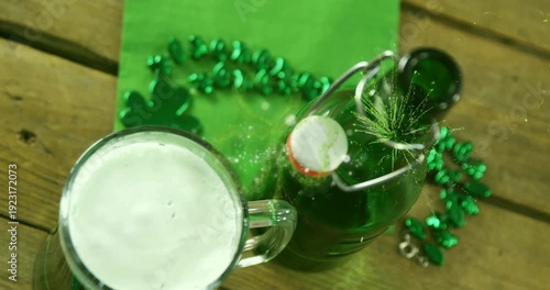 Pressure buildup popping swing-top cap, bottle ejecting spray toward mug, celebrating Patrick's Day