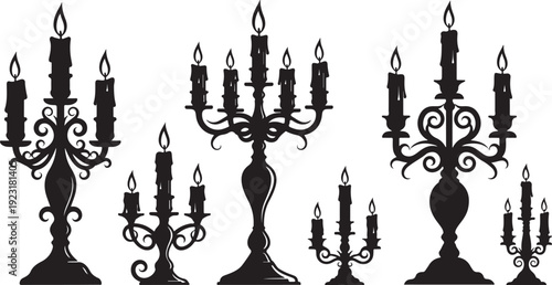 Silhouette of various candelabras with lit candles on stands