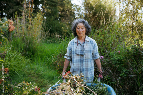 Elderly woman engaged in gardening activities outdoors