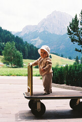 Baby Adventure Begins with a Luggage Cart Ride Film Photo 