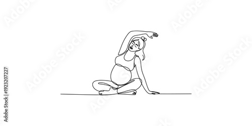 Pregnant woman doing side bend stretch during prenatal yoga session