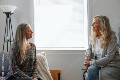 Women engaging in a hard conversation in a cozy indoor setting