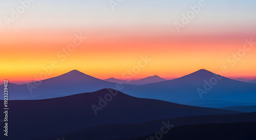 Serene mountain landscape at dusk with vibrant sky.