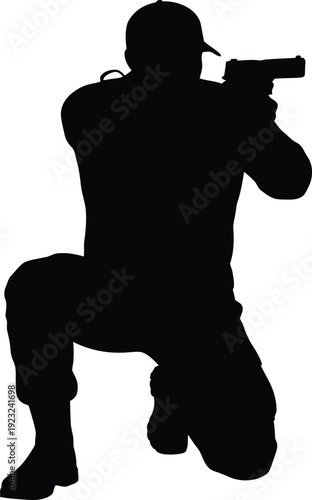 Silhouette of a Tactical Officer in Combat Gear Kneeling and Aiming a Handgun Pistol during a Professional Security Training Session