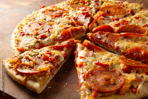 A closeup view of a dairy-free, gluten-free spicy salami pizza.