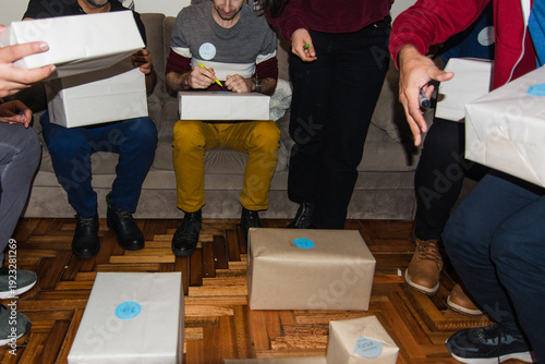 Friends opening presents from secret santa