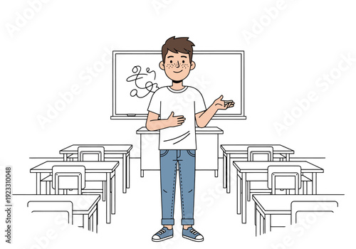 Young man standing at the front of an empty classroom with desks and a whiteboard behind him ready to teach