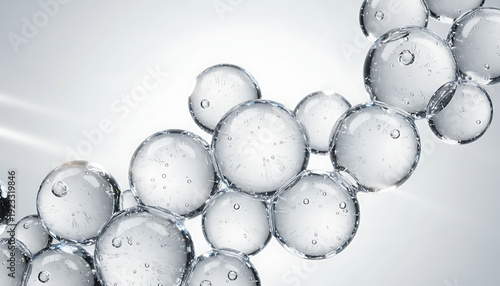 Close-up of numerous transparent liquid spheres with trapped air bubbles, showcasing a clean, abstract scientific or cosmetic texture