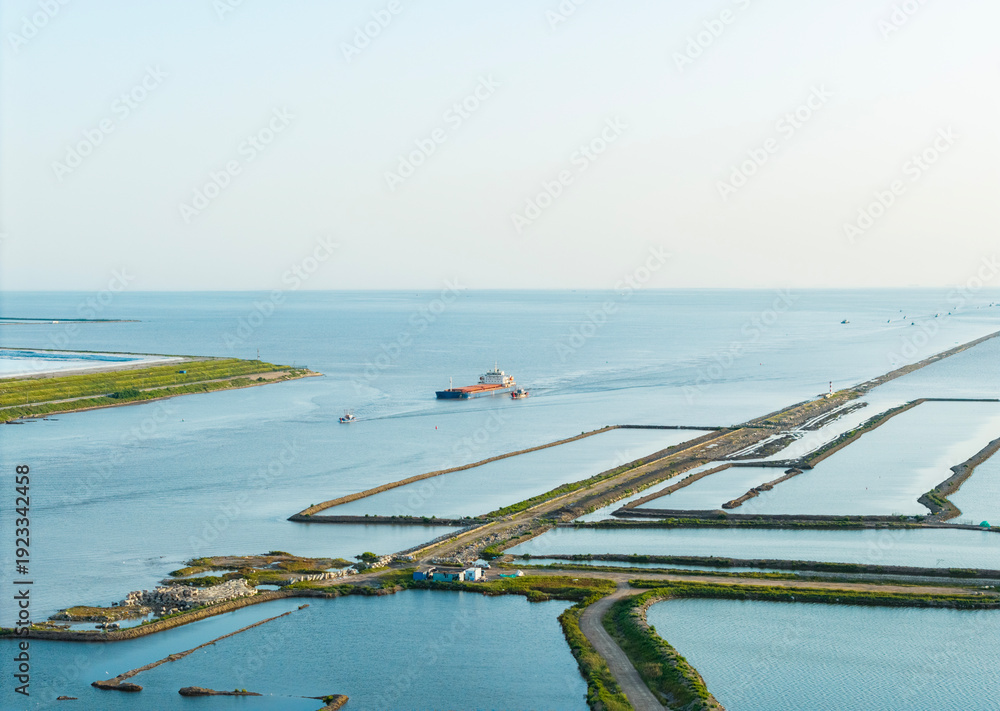 Obraz premium Aerial photo of the cargo ship setting sail