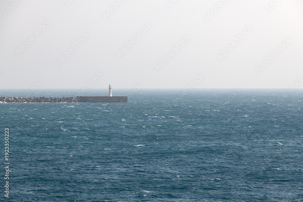 Obraz premium idyllic seascape with a lighthouse