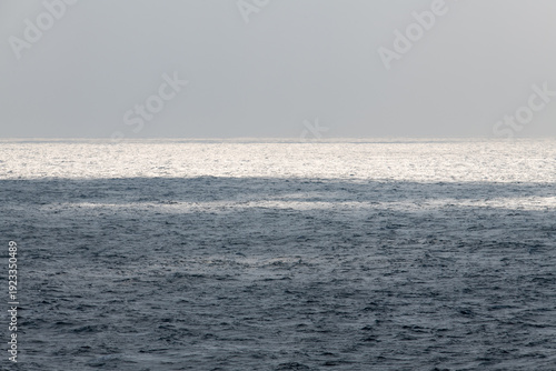 idyllic seascape with sunlight-reflecting sea