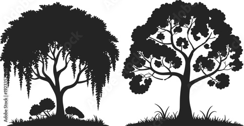 Black silhouette set of two diverse leafy trees with grass and shrubs isolated on white background for nature and landscape design