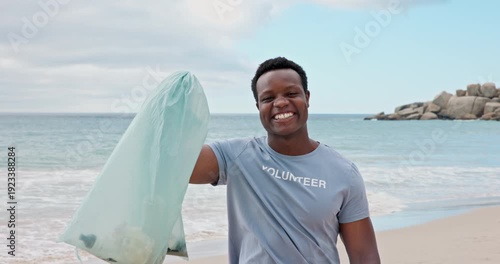 Excited, face and man with trash, beach and cheering for social responsibility, cleaning or recycle. Sea, black person and waste management for community service, laughing and volunteering in nature