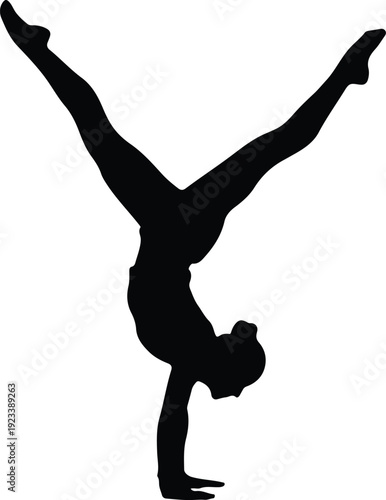 Graceful gymnast performing an impressive handstand split in mid-air