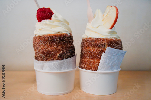 Traditional Czech Trdelnik Pastry Filled with Soft Serve Ice Cream and Strawberry