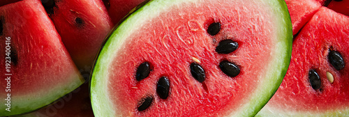 Close-up of juicy watermelon slices with black seeds, refreshing summer fruit
