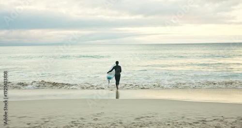 Running, waves and man on beach with surfboard for water sports, adventure and hobby on holiday. Surfer, nature and back of person ready for surfing activity in ocean on vacation, break and weekend