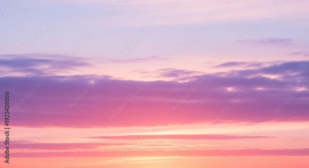 Fototapeta premium Beautiful pastel dawn sky blending soft pink and blue tones.