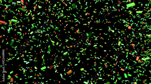 A vibrant display of green and red confetti scattered on a black background