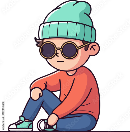 A young boy sitting on the ground wearing casual clothing and sunglasses, viewed from a slightly elevated angle