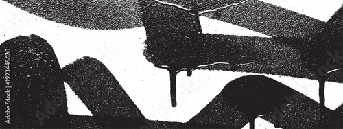 Abstract black and white graffiti art with dripping paint texture.