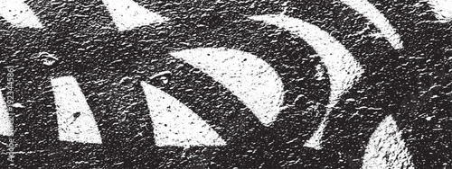 Abstract black and white pattern with curved and triangular shapes.