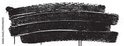 Abstract black brush stroke texture on white background.