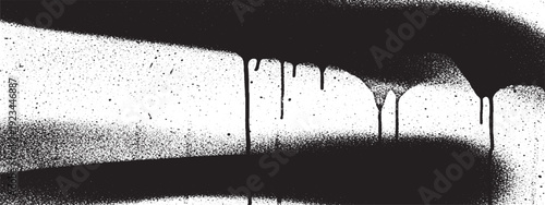 Abstract black spray paint drips and streaks on a white textured surface creating a grunge and urban art effect.