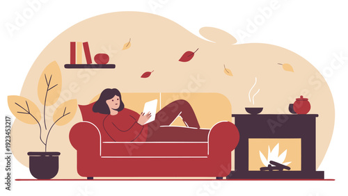Woman relaxes on a red sofa by a cozy fireplace, enjoying a tablet during autumn season.