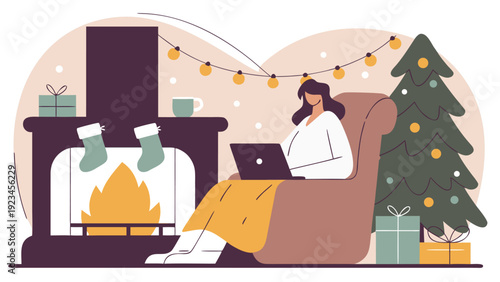 Woman works on a laptop in an armchair, by a fireplace with stockings and a decorated Christmas tree.