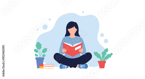 Young woman sits comfortably in a cross-legged position while focused on reading an open book against a soft blue abstract background with plants.