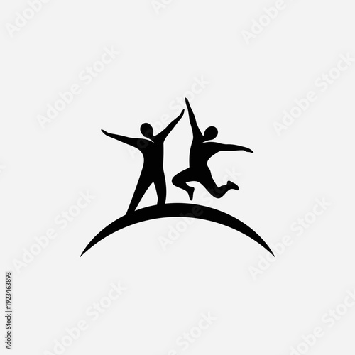 Two people high fiving on hill.