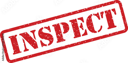 A red rubber stamp with a textured grunge effect clearly shows the word INSPECT on a white surface