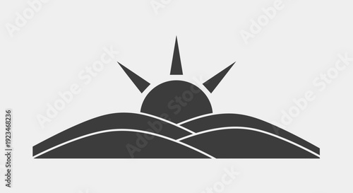 Black sun rising over hills.