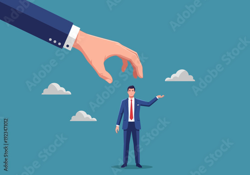 Businessman standing under a giant hand with clouds floating around him in a blue background