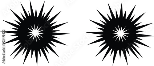 Two black starburst or explosion graphic elements with sharp radiating points silhouette