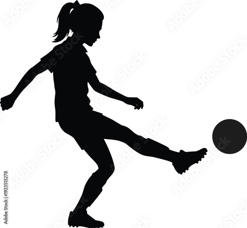 Black silhouette of girl kicking soccer ball