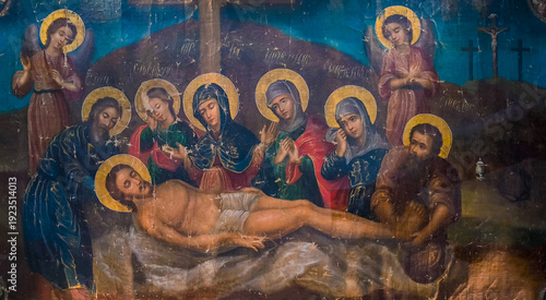An old icon depicts the Entombment of Christ, at the Sihastria Monastery - Romania. It is a biblical scene painted on canvas