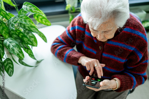 Принти на полотні Senior facing phone scams and digital safety.