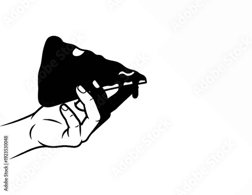 A hand holds a slice of rich, dark cake with glossy frosting