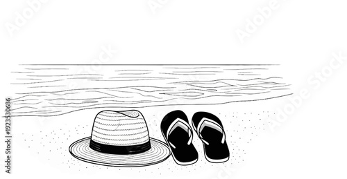 A hat and flip-flops rest on the sand by the ocean waves