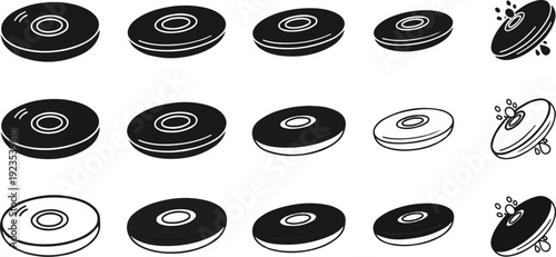 A collection of black and white circular objects with a hole in the center