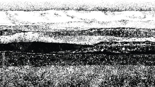 Abstract black and white grunge texture with speckled patterns and layered design